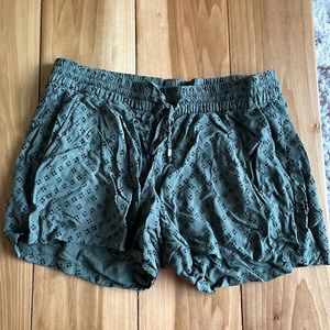 Green Old Navy loose fitting shorts with black details.
